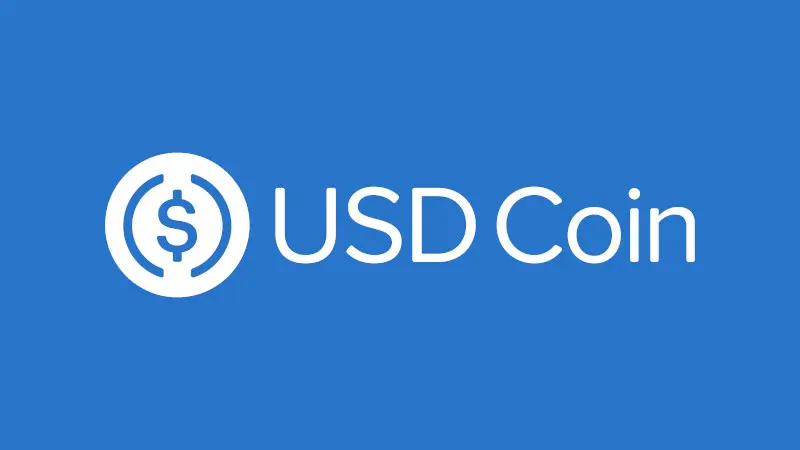 USD Coin logo with a white dollar sign symbol and text on a blue background