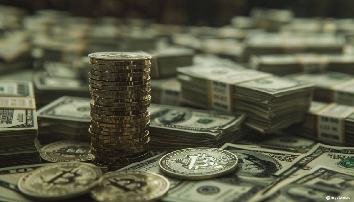 A stack of Bitcoins on a pile of US dollar bills.