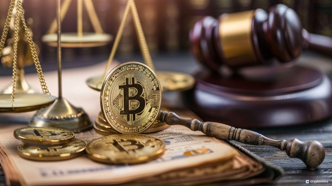 A gavel on a desk with cryptocurrencies.