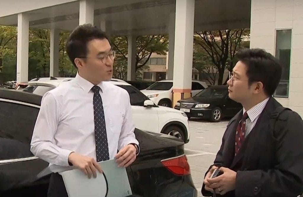 Lawmaker Kim Nam-guk (center), the man at the heart of the ‘Coin Gate’ scandal allegations, outside a courthouse in Seoul.