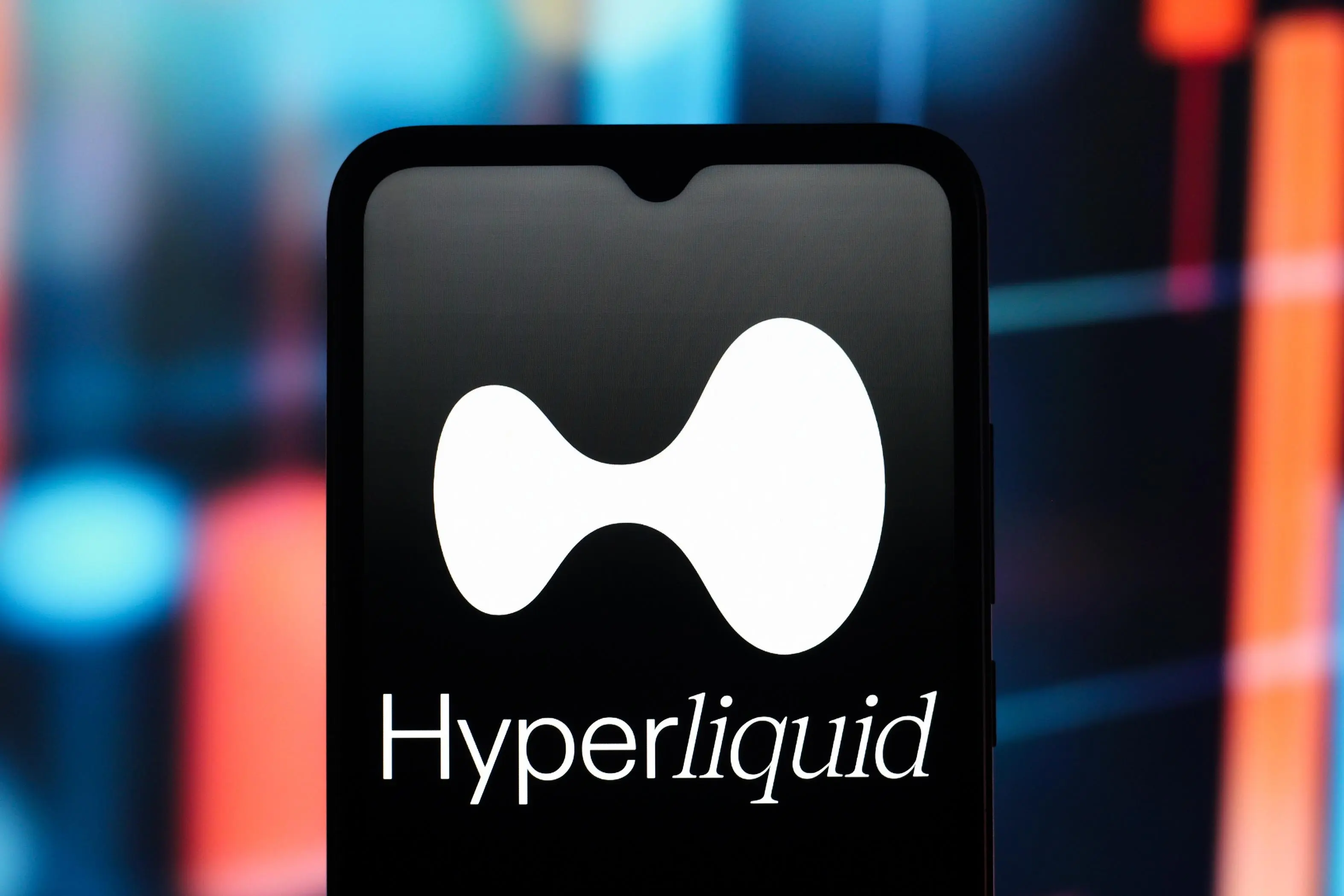 Close-up of the Hyperliquid logo on a smartphone screen.