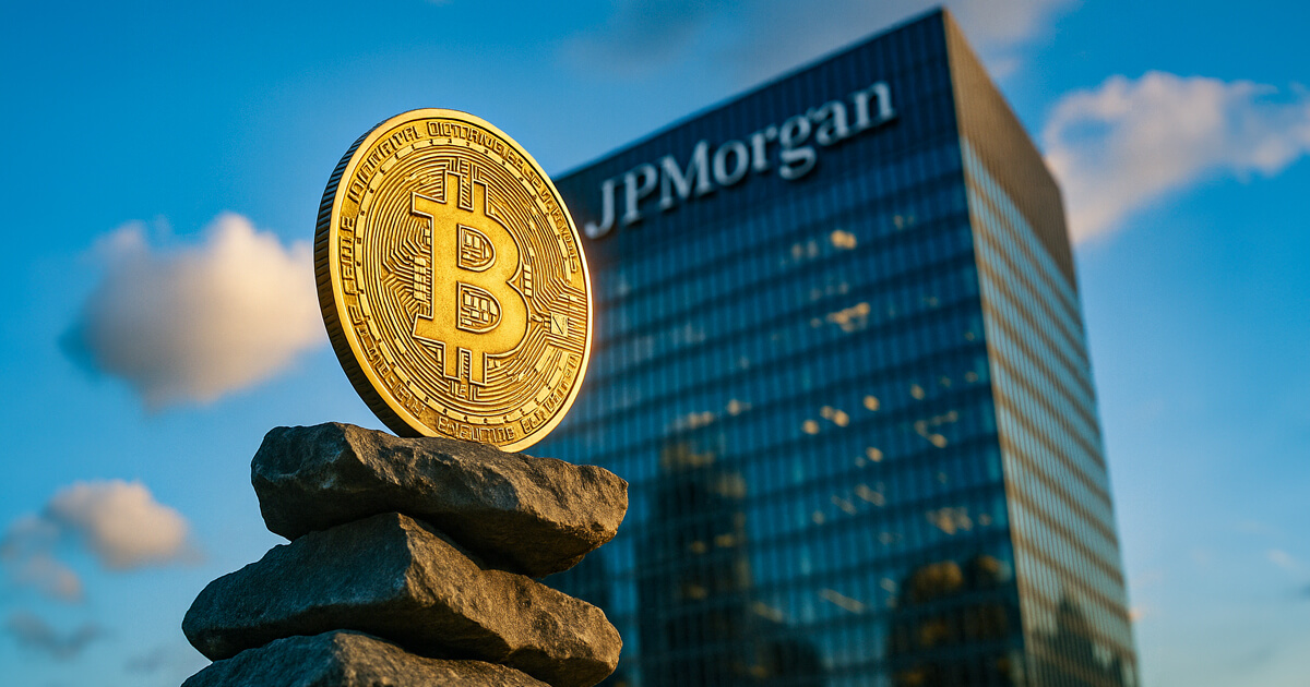 A large golden Bitcoin coin stands on a stack of rocks in front of the JPMorgan headquarters building at sunset.